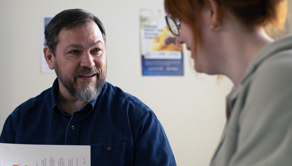 Surgeon talking to patient